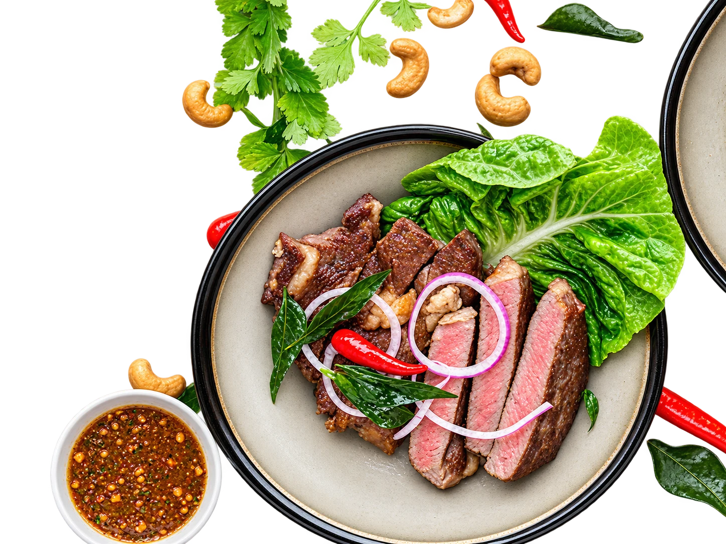 Steak salad plate with herbs and dipping sauce